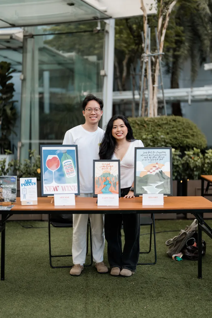Four One Two scripture art prints at a pop-up market in Singapore — photo 1