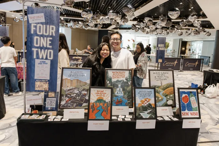 Four One Two scripture art prints at a pop-up market in Singapore — photo 2