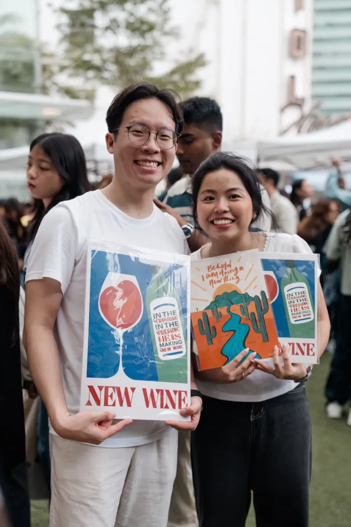 Four One Two scripture art prints at a pop-up market in Singapore — photo 5