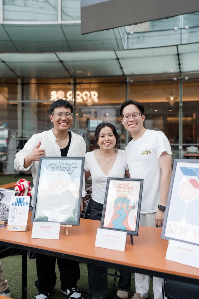 Four One Two scripture art prints at a pop-up market in Singapore — photo 6