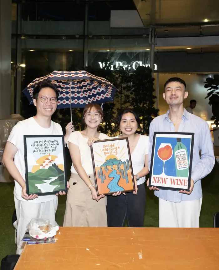 Four One Two scripture art prints at a pop-up market in Singapore — photo 7